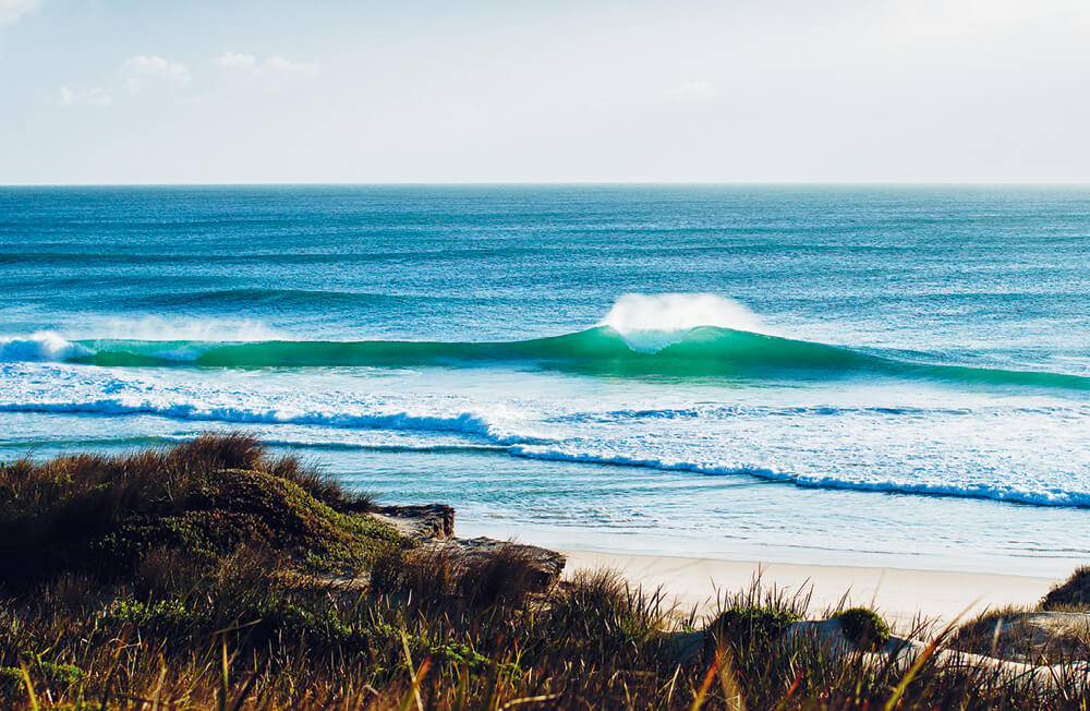 A perfect A-Frame wave, empty of surfers